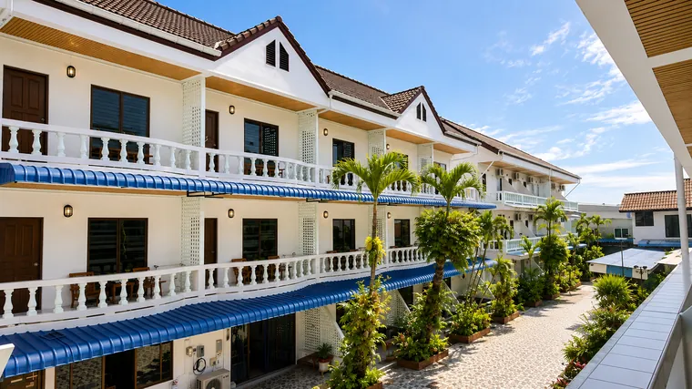 Quiet hotel courtyard with palm trees